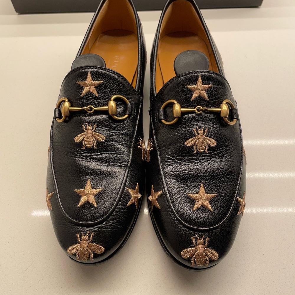 Gucci Black Flats with Gold Accents